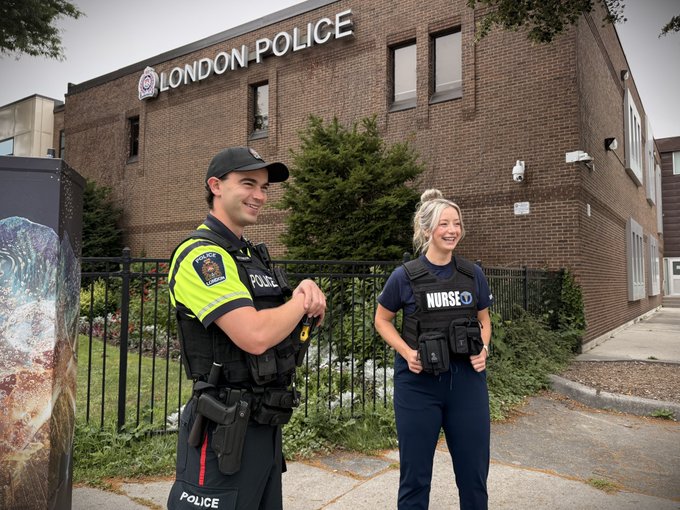LPS Officer and LPS Nurse Program Nurse standing in front of LPS HQ
